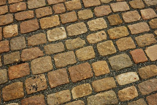 Close up of old cobblestones. Suitable as background.