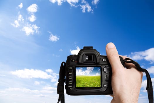 simple and clear nature concept with clouds and digital camera