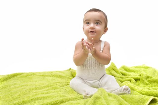beautiful baby with the green towel on white background



 