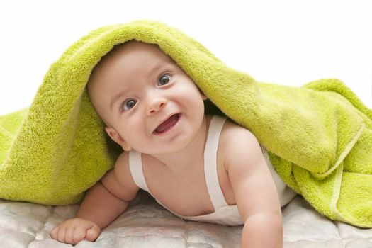 beautiful baby with a towel over your head
