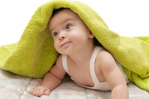 beautiful baby with a towel over your head
