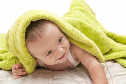 beautiful baby with a towel over your head
