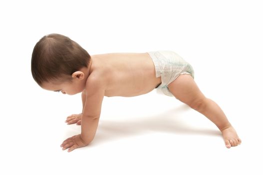 beautiful baby doing push ups isolated on white background
