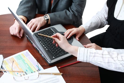 work in office, focus point on nearest hand of woman