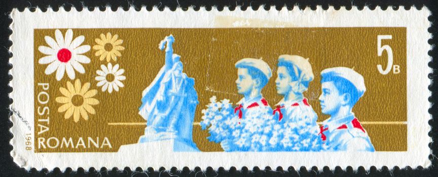 ROMANIA - CIRCA 1968: stamp printed by Romania, shows Pioneers and Liberation Monument, circa 1968