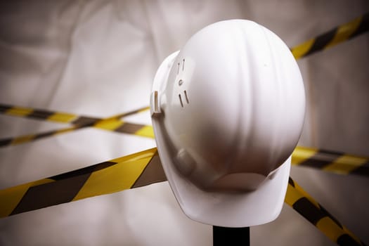 industrial concept, selective focus on nearest part of white hardhat