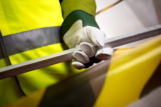 industrial concept with part of  worker, selective focus on hand with protective glove