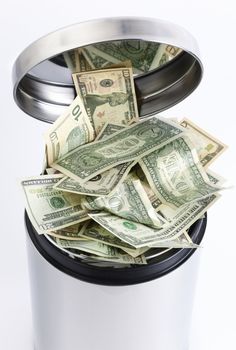 finance concept with money and metal tub on white background, focus on papers