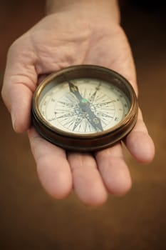 compass on the hand, selective focus,lens blur