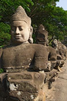 Photo of the statues at the entrance to Angkor Thom in Cambodia.