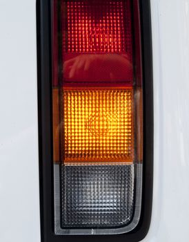 Modern car headlight - red, yellow, green