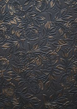 Floral ornament embosed on leather - decoration