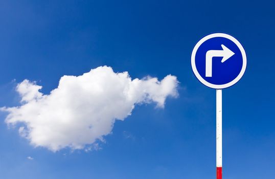 Curved Road Traffic Sign over blue sky,turn right