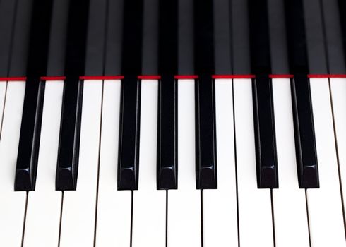Close up image of the keys of a grand piano
