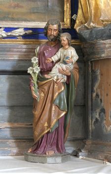 Saint Joseph holding baby Jesus