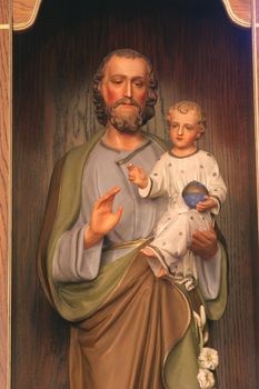 Saint Joseph holding baby Jesus
