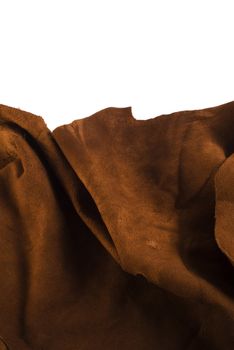 Brown cow leather texture close up on white background. Included clipping path, so you can easily cut it out and place over the top of a design.