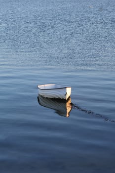 Lonely white rowing boat