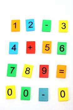 Educational blocks with different numbers over white 