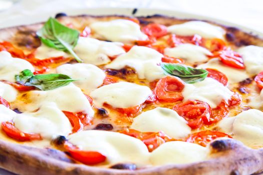 This is a true Italian Pizza. Traditional Pizza Margherita served in a Capri's restaurant, Naples Gulf, Italy.