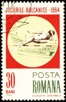 ROMANIA - CIRCA 1964: A post stamp printed in Romania shows high-jumper, devoted to Balkan games, series, circa 1964