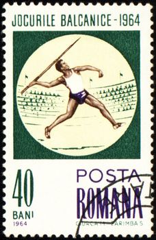 ROMANIA - CIRCA 1964: A post stamp printed in Romania shows javelin throwing, devoted to Balkan games, series, 

circa 1964