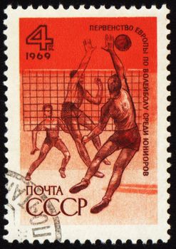 USSR - CIRCA 1969: A stamp printed in the USSR shows volleyball competition, circa 1969