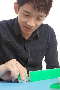 Chinese man play Mahjong, traditional China gamble. 