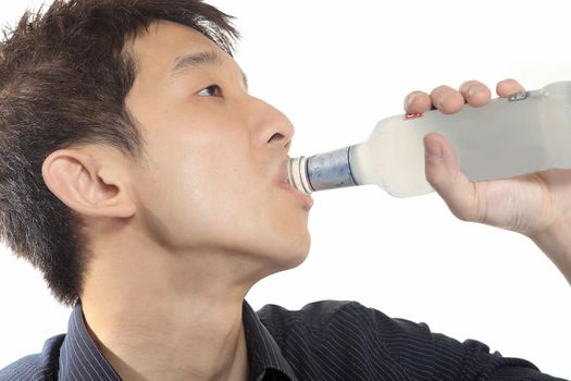 asia man takes drink on white