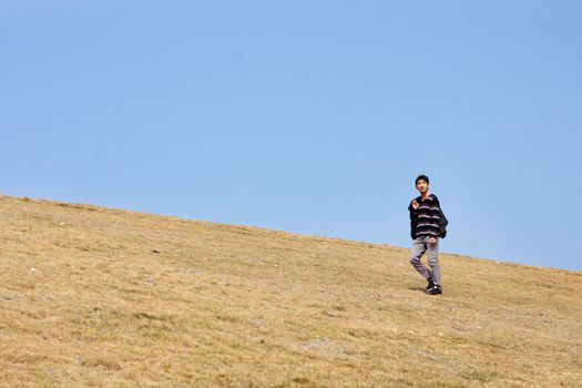 man walking on the mountain