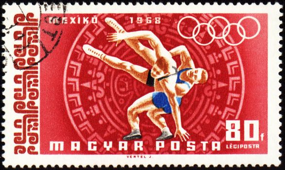 HUNGARY - CIRCA 1968: A post stamp printed in Hungary shows wrestling, devoted to Olympic games in Mexico, series, circa 1968