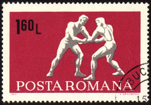 ROMANIA - CIRCA 1969: A post stamp printed in Romania shows wrestling, series, circa 1969