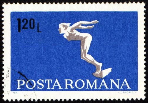 ROMANIA - CIRCA 1969: A post stamp printed in Romania shows diving swimmer, series, circa 1969