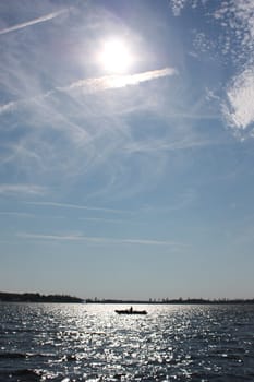 Boat on a lake under a blue sky