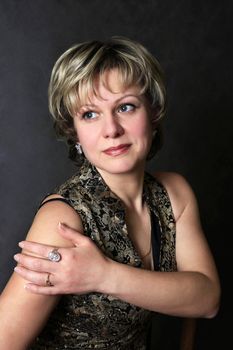 Portrait adult woman on a dark background