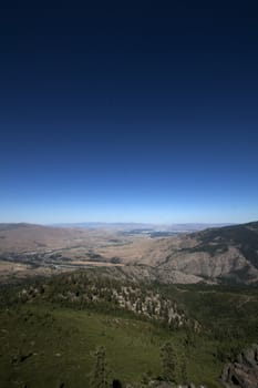 HIgh shot of a mountain range with a blue sky