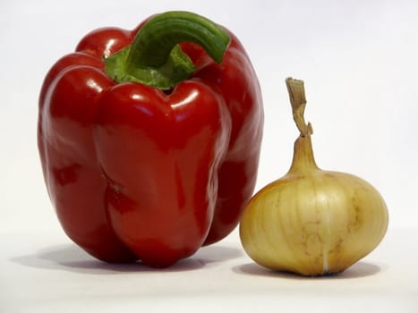 		
The image of an onions and pepper on a homogeneous background