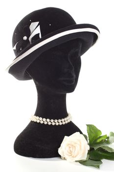 Head a dummy in a hat with rose isolated on white