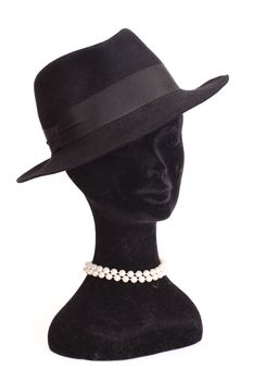 Head a dummy in a hat with beads isolated on white