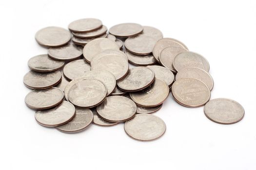 A pile of US Coins shot on a white background