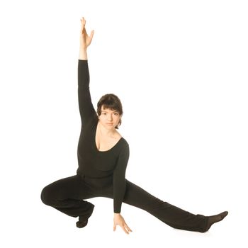 A young woman dancing jazz-modern in a scenical pose