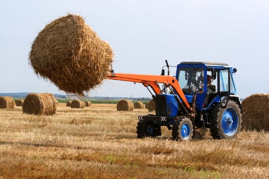 Preparation of hay for the winter a tractor