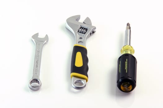 three work tools wrench and screwdriver isolated on white background construction equipment