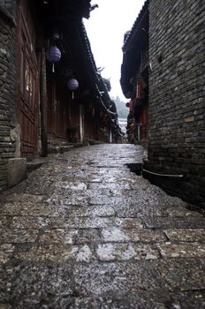 A narrow village street in a market in Lijiang, China in the Yunnan provence.