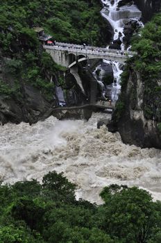 A bridge crossing a stream in Tiger Leaping gorge, Yunnan, China