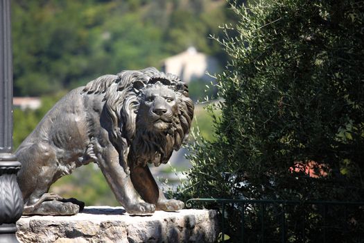 lion statue in park park on background