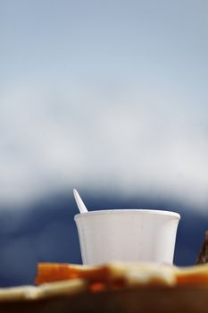 coffee in cup mountains on background