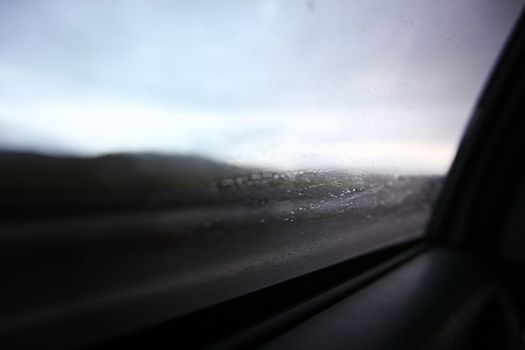 drive on rain window in drops