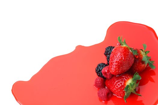 berry mixed pile in syrup isolated on white