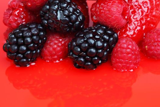 berry mixed pile in syrup isolated on white